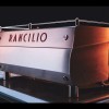 This image is a back-side view of the Rancilio Specialty RS1 3 group espresso machine in Stainless Steel.